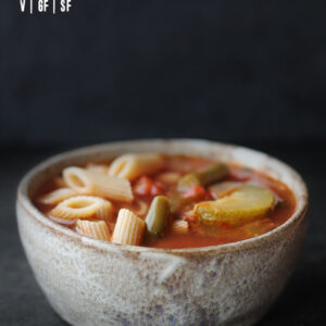 Bowl of minestrone soup with black background