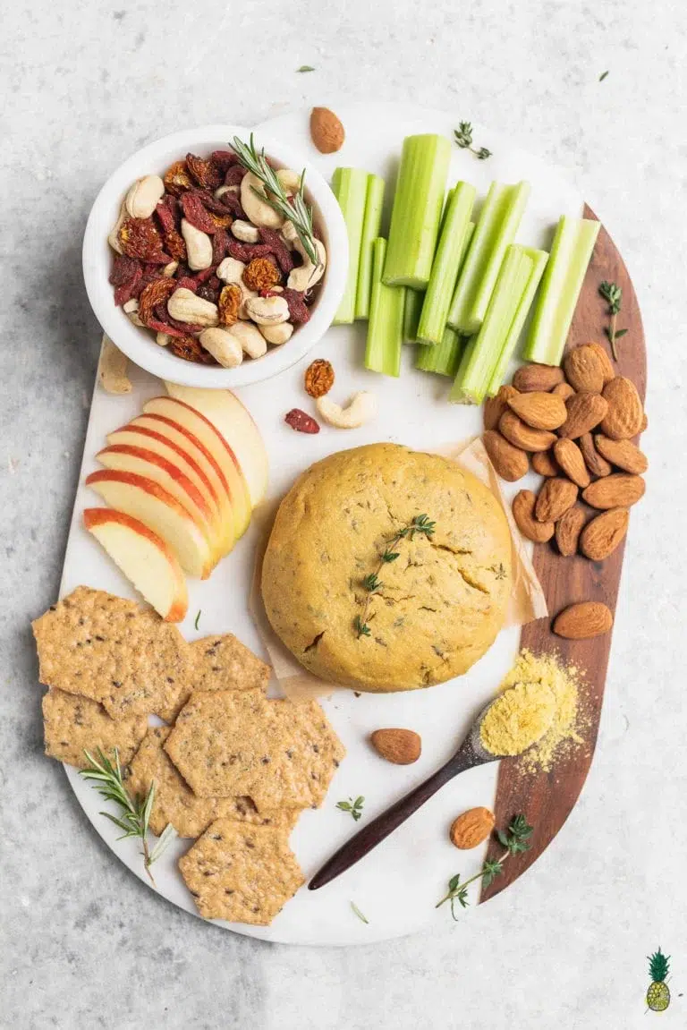 A Vegan tray with nuts, crackers and cheese for Holiday recipes.