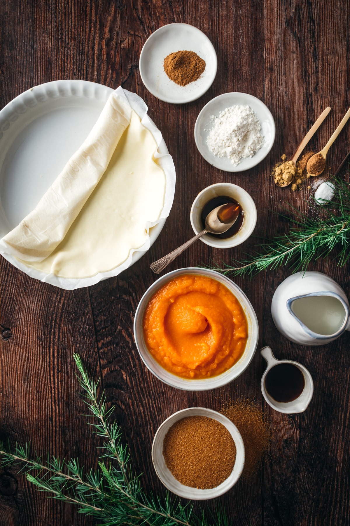 The ingredients for this vegan pumpkin pie recipe including the pie crust and the pie filling ingredients.