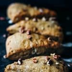Photo of banana nut scones with a black background.