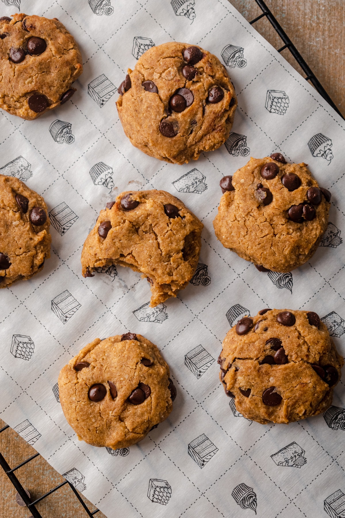Close up of chewy pumpkin chocolate chip cookies on a cooling rack. 