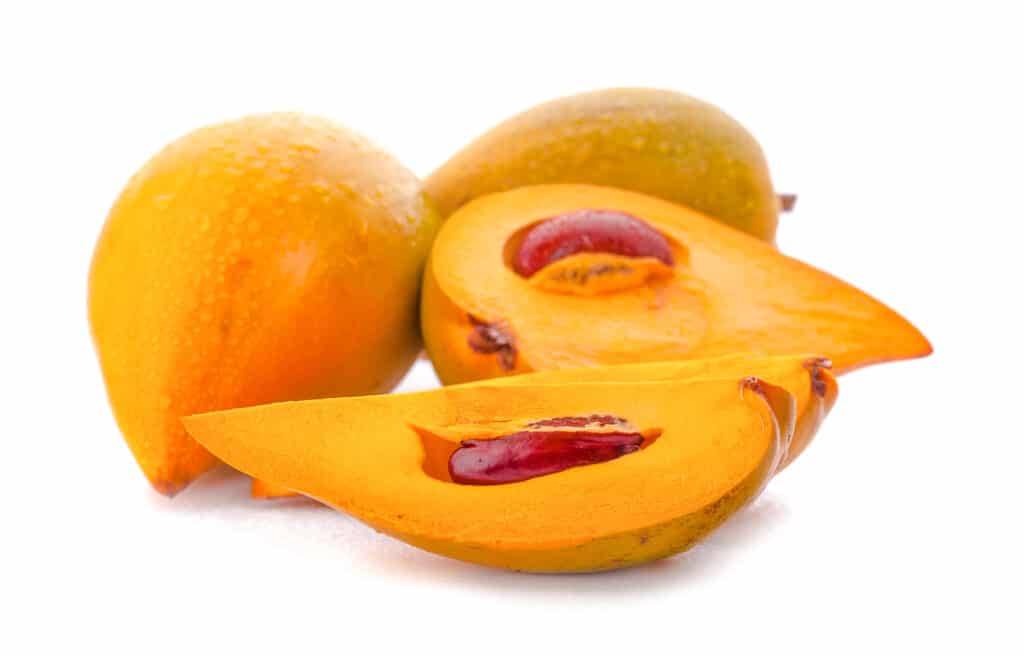 Yellow-orange tear drop shaped fruit.
