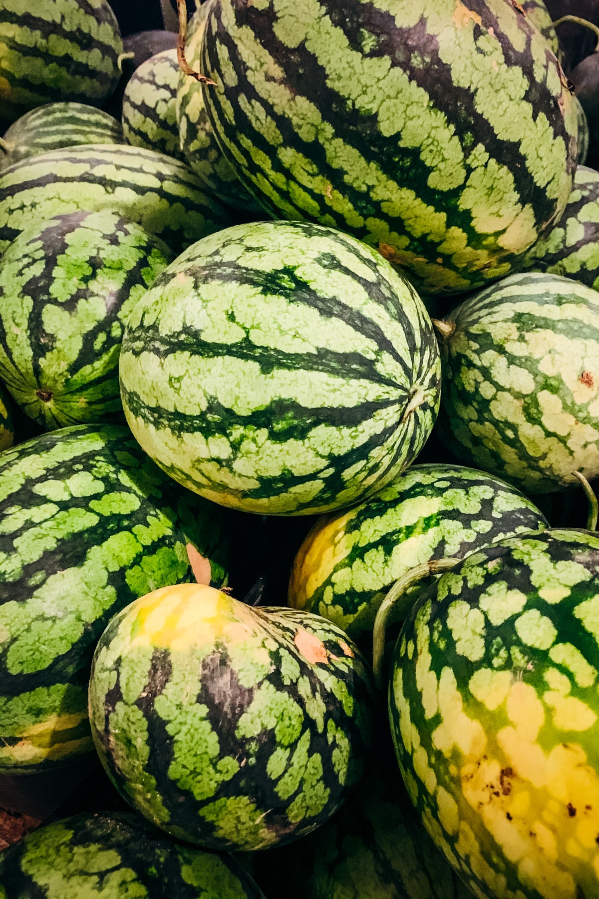 Pile of large ripe watermelons.
