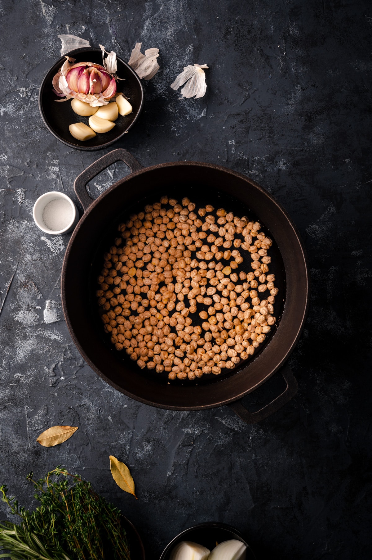How to cook chickpeas with the garbanzo beans in a pot and aromatics to the side.