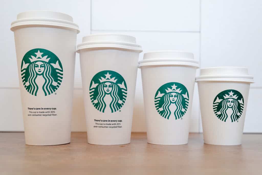 Horizontal shot of the four different hot cup sizes at Starbucks.