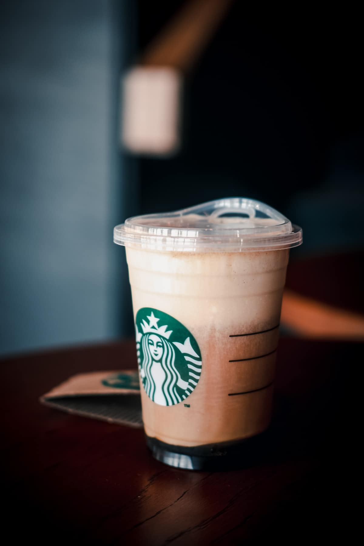 Iced nitro cold brew coffee in ready to drink at Starbucks to-go cup.