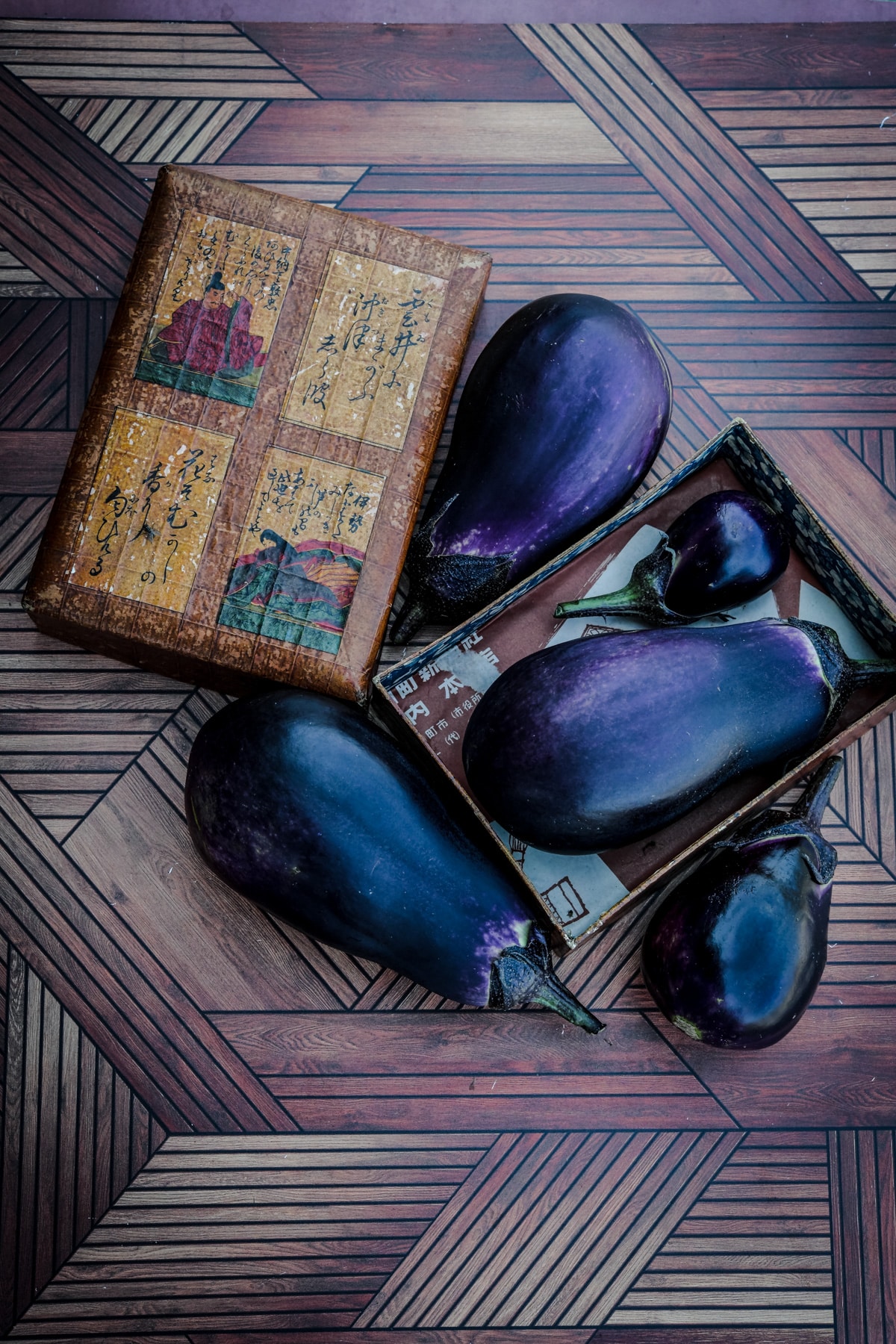 Mitoyo eggplant on a wooden surface.