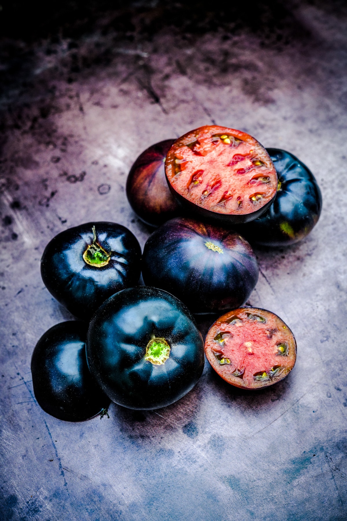 Black beauty tomato with black skin and red flesh.
