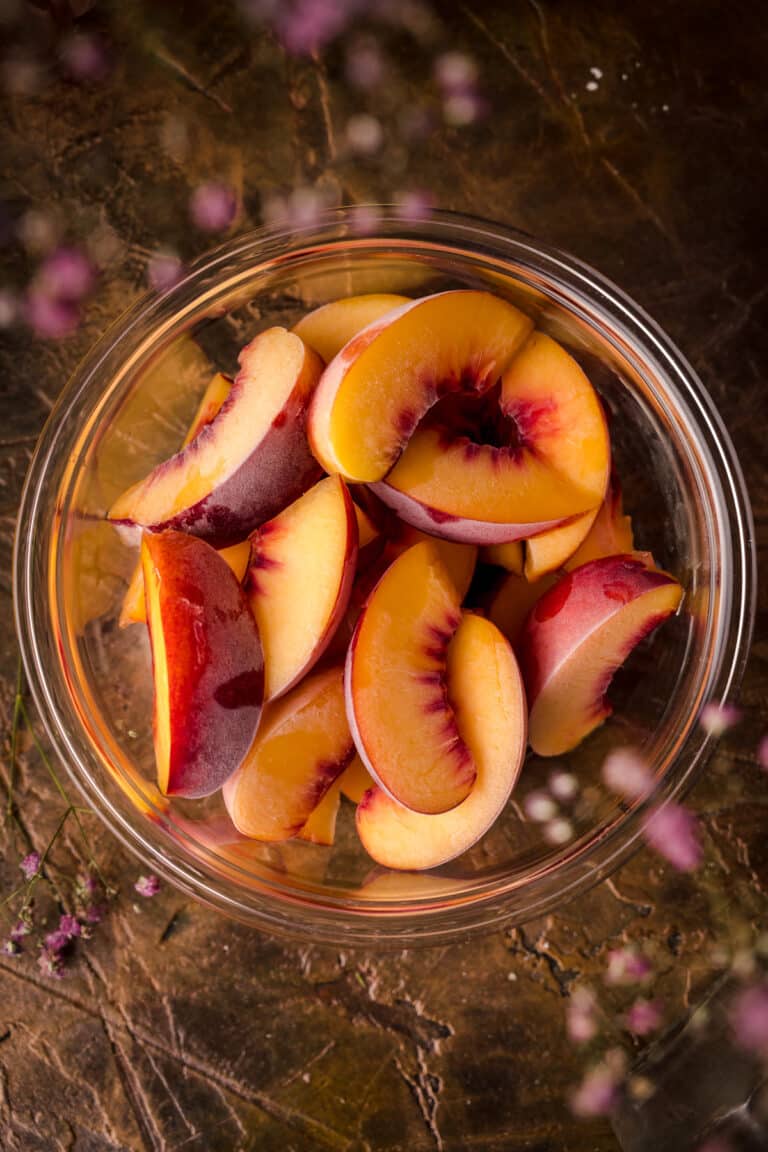 Close up image of frozen peaches.