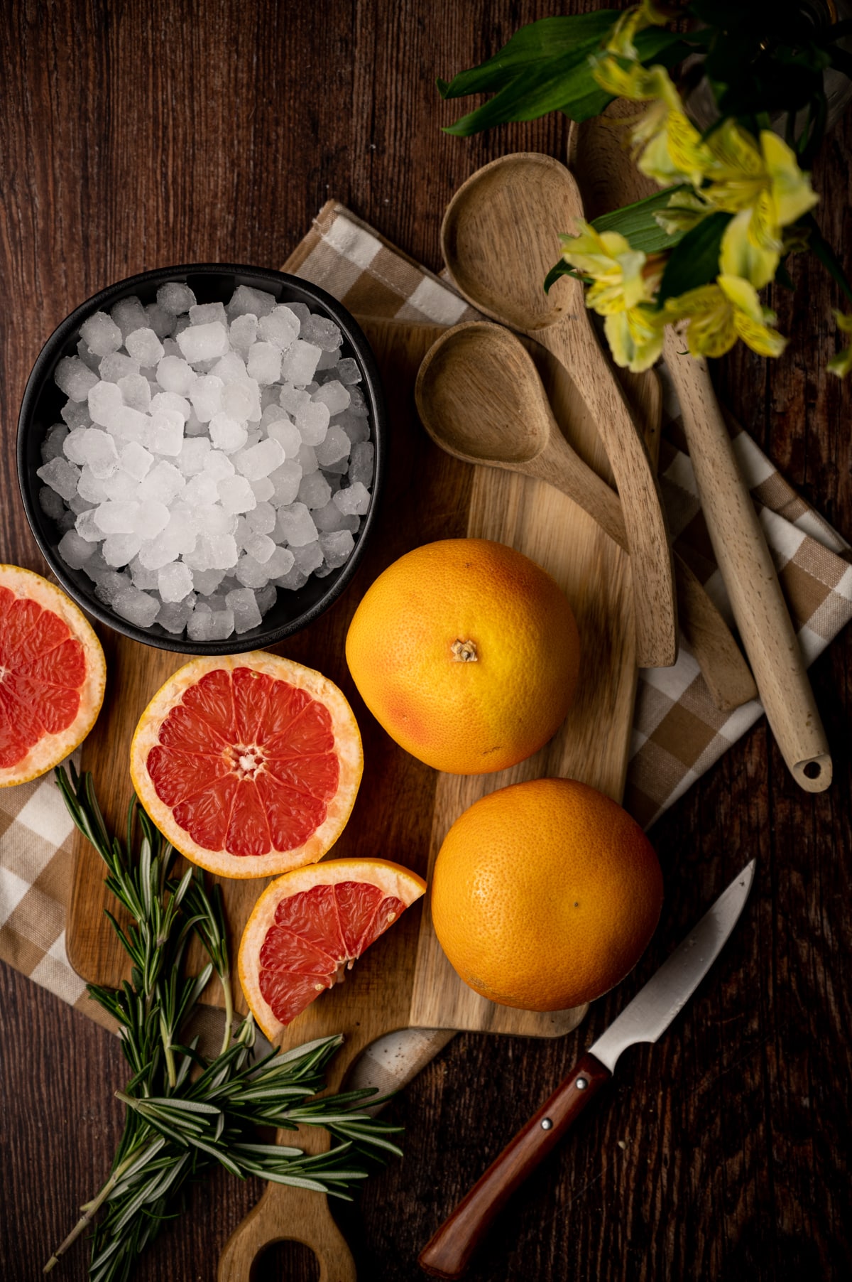 Ingredients for grapefruit water with sprigs of rosemary.
