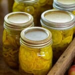 Quart sized jars filled with pickled zucchini and yellow summer squash.
