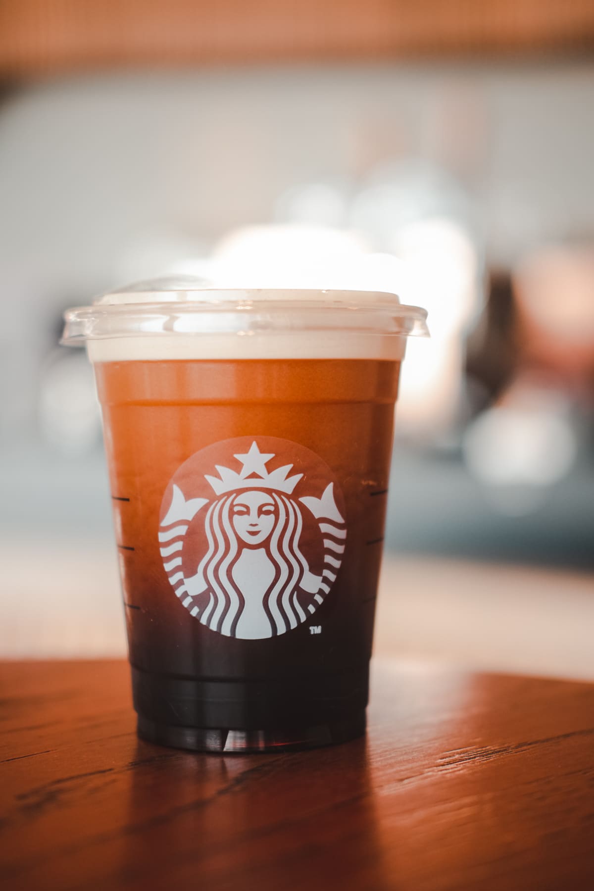 Starbucks Nitro Cold Brew Coffee in the Starbucks take away plastic cup with white logo.