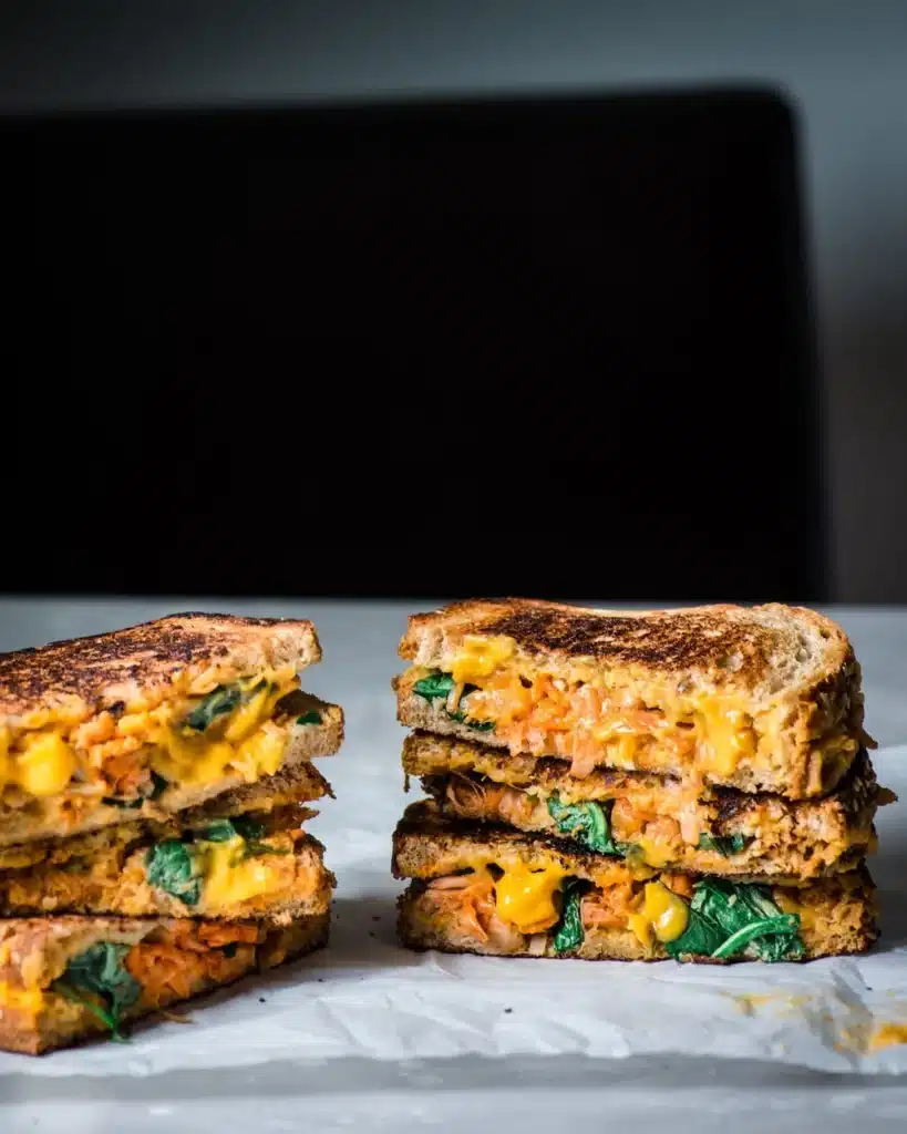 Vegan grilled cheese with jackfruit and greens.