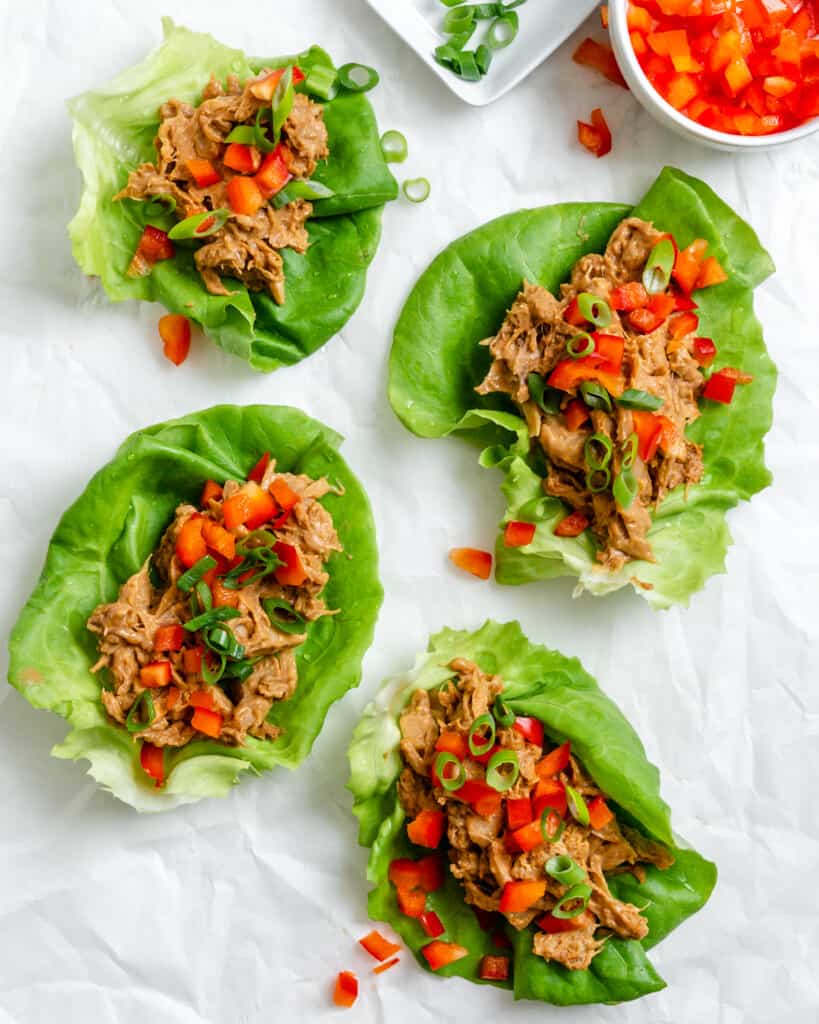 Lettuce cups topped in seasoned jackfruit, and chopped veggies.