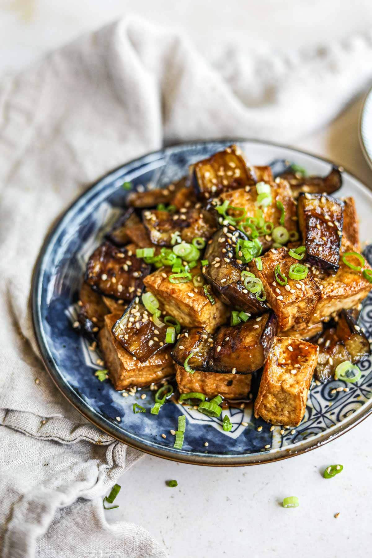 Vegan tofu dish garnished with sesame seeds.