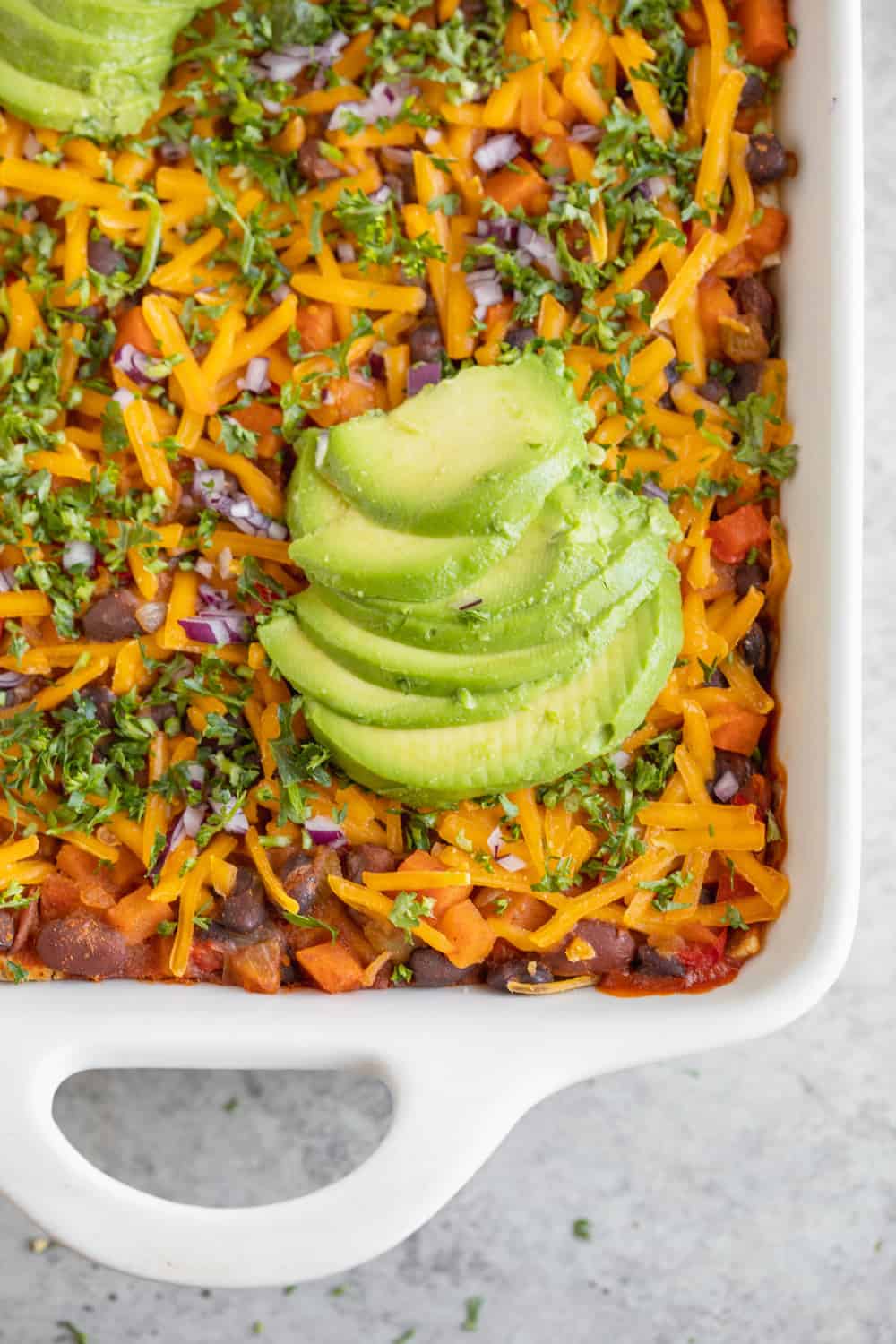 A 60-recipe vegan casserole collection featuring avocado and black beans.