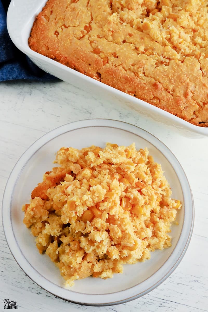 A vegan casserole recipe for cornbread, served in a dish on a table.