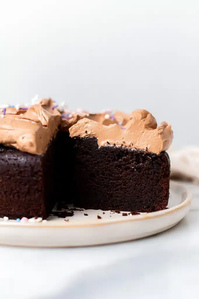 Small single layer chocolate cake with vegan milk chocolate buttercream frosting.