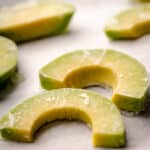 Close up of frozen avocado slices.