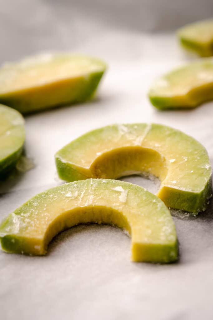 Close up of frozen avocado slices.