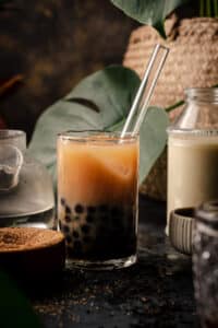 Bubble tea in a glass on a dark background.