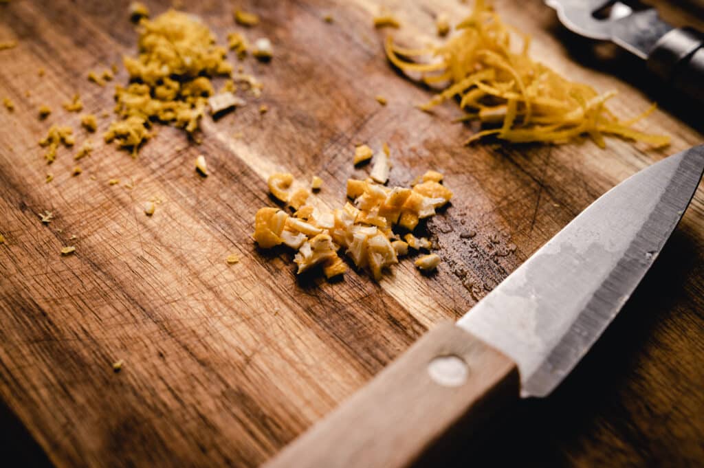 A knife on a wooden cutting board.