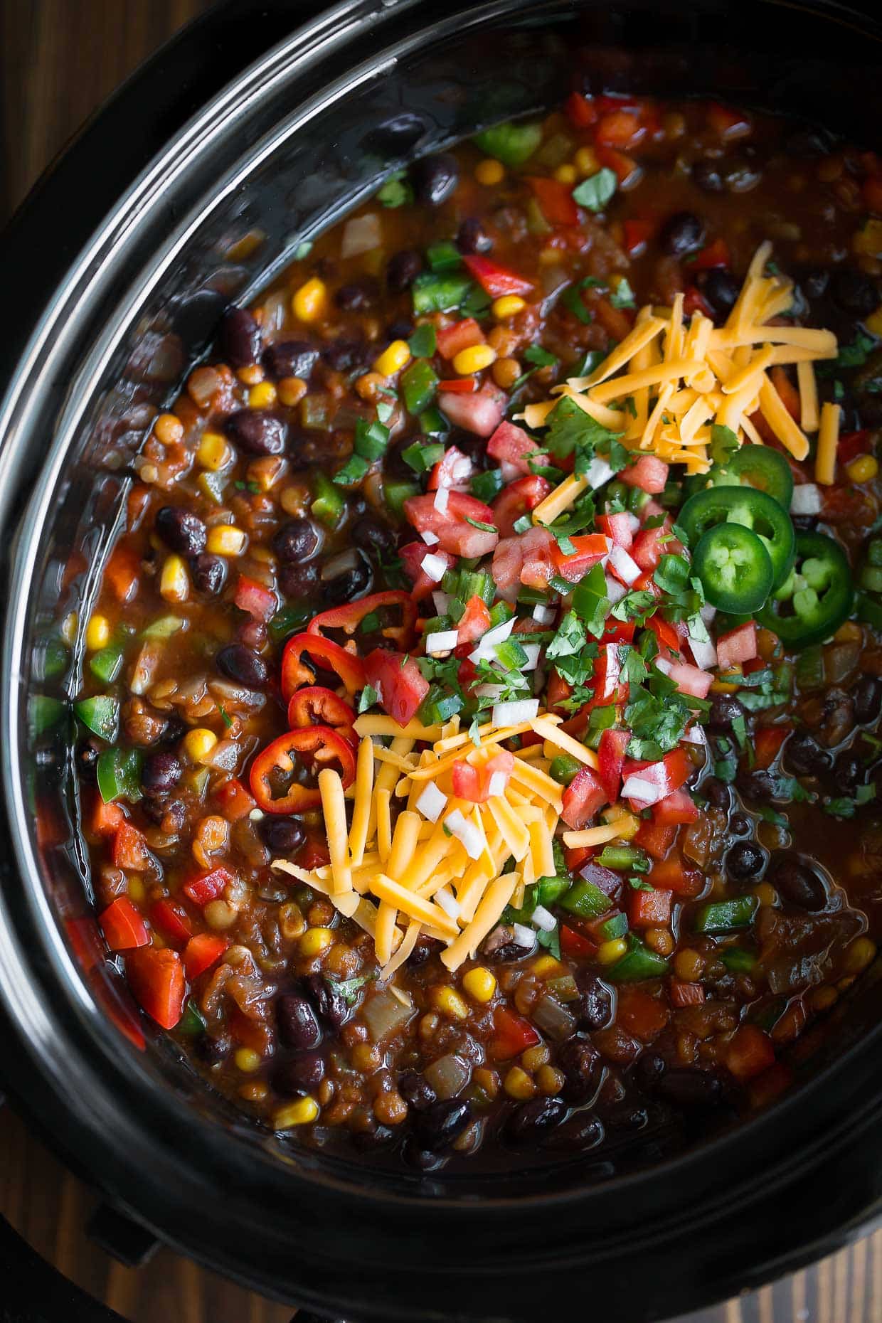A crock pot full of chili and beans.