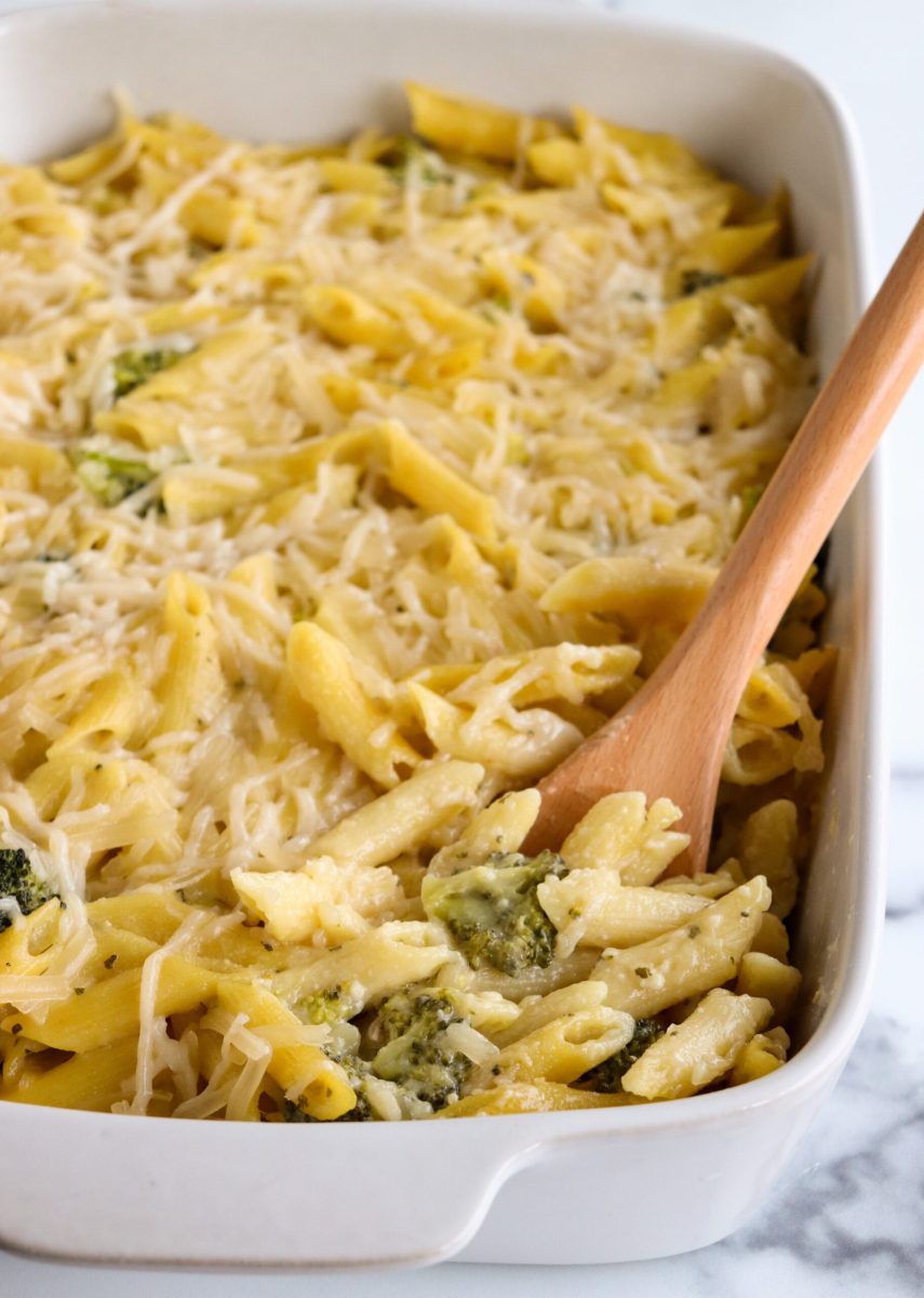 A dish of pasta with broccoli and cheese.