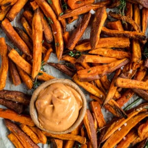 Sweet potato fries with a dipping sauce.