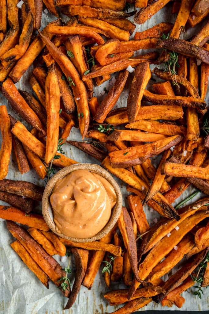 Sweet potato fries with a dipping sauce.