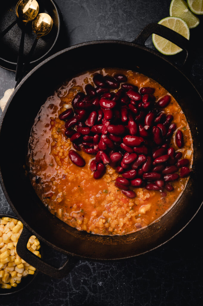 Mexican bean and corn stew in a cast iron pan.