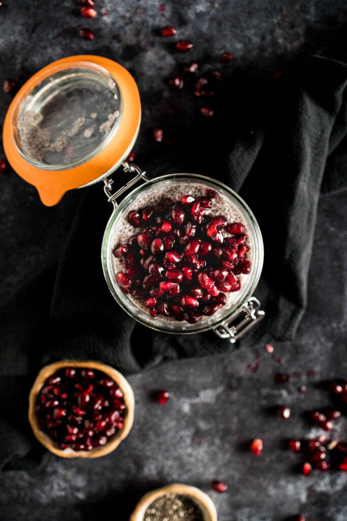 Flavorful pomegranate arils on top of chia seed pudding.