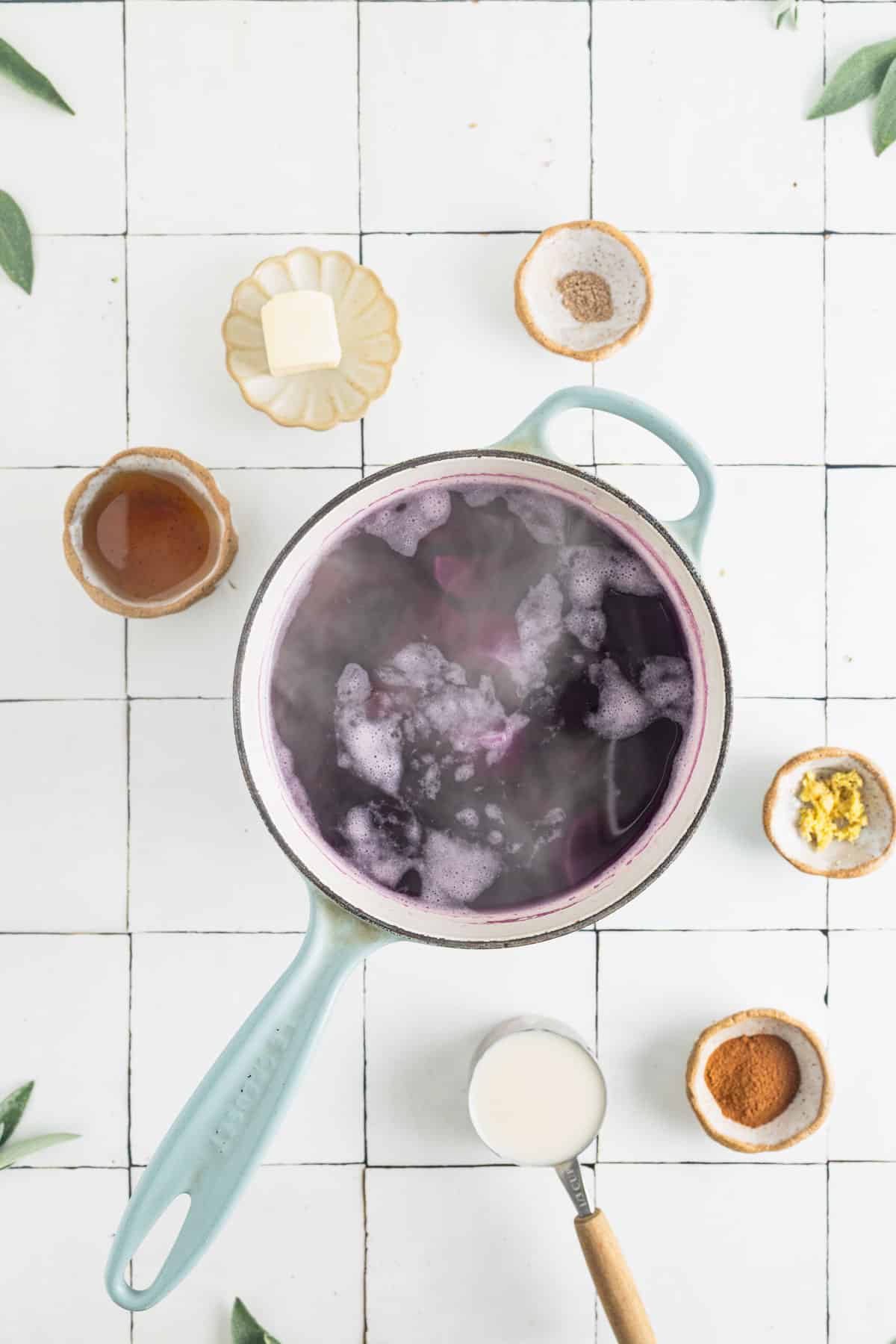 Sweet potato chunks boiling in a pot of water.