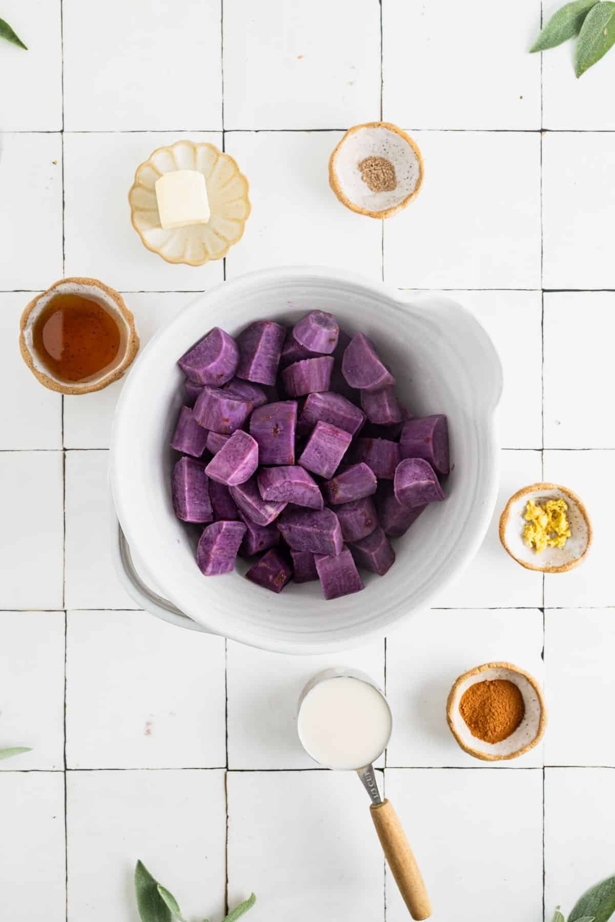 Ingredients for dairy free sweet potato casserole in a large mixing bowl.
