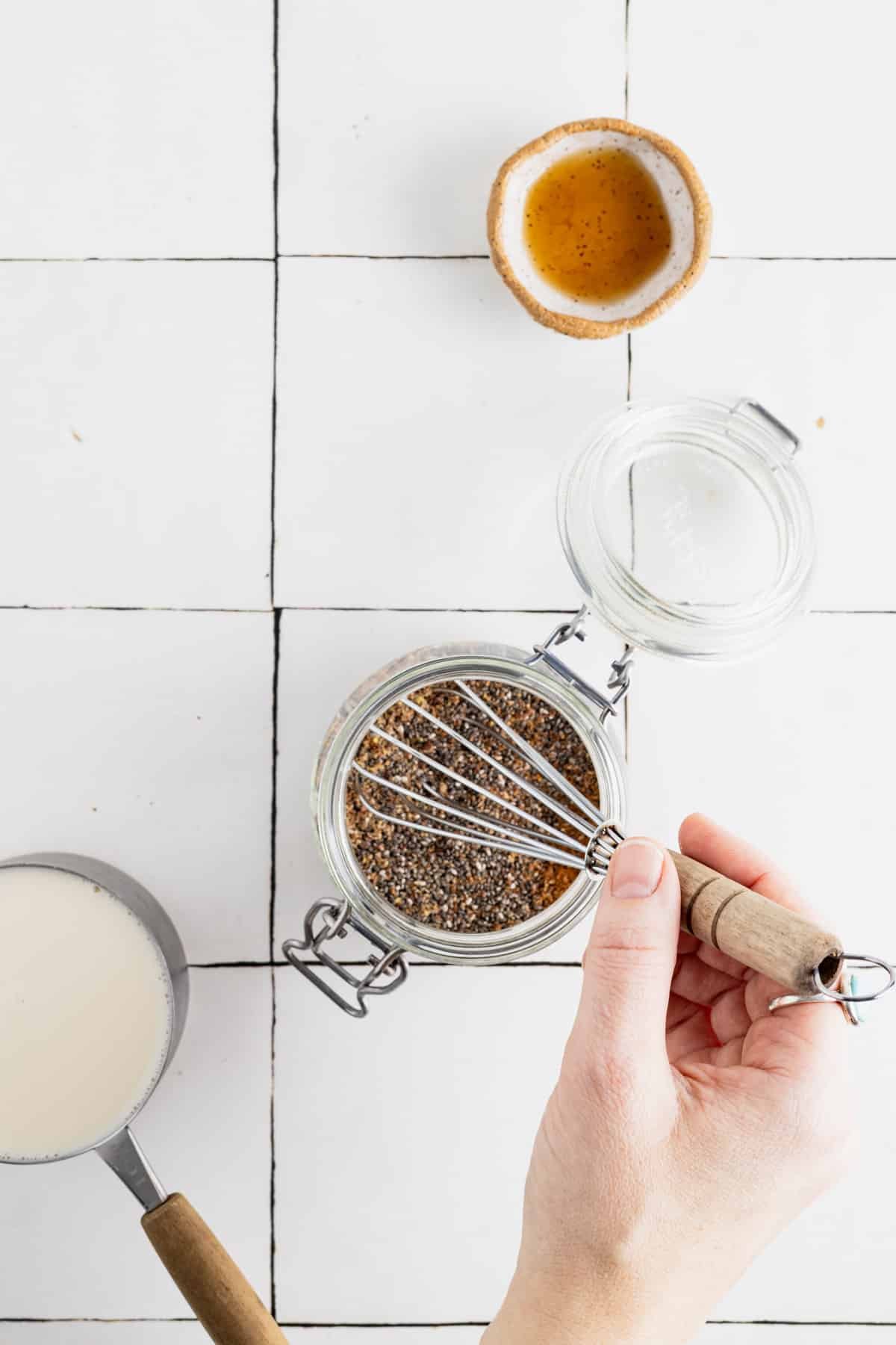 Whisking dry ingredients for flaxseed chia pudding together.
