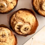 Close up of banana protein muffins in the baking tin.