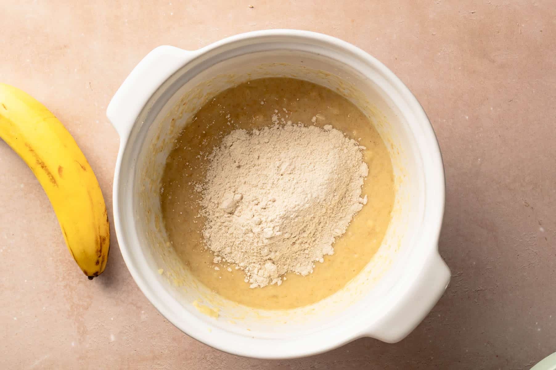 Dry ingredients added to the large bowl of wet ingredients.