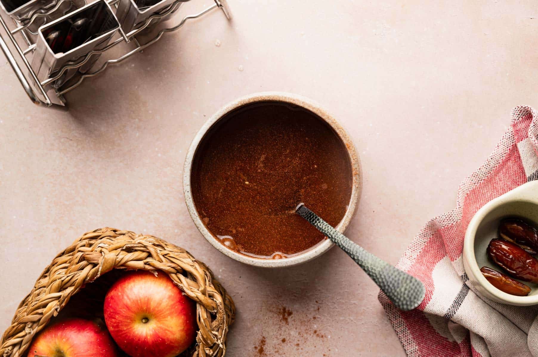 Mixing cinnamon and chopped dates together in a small bowl.