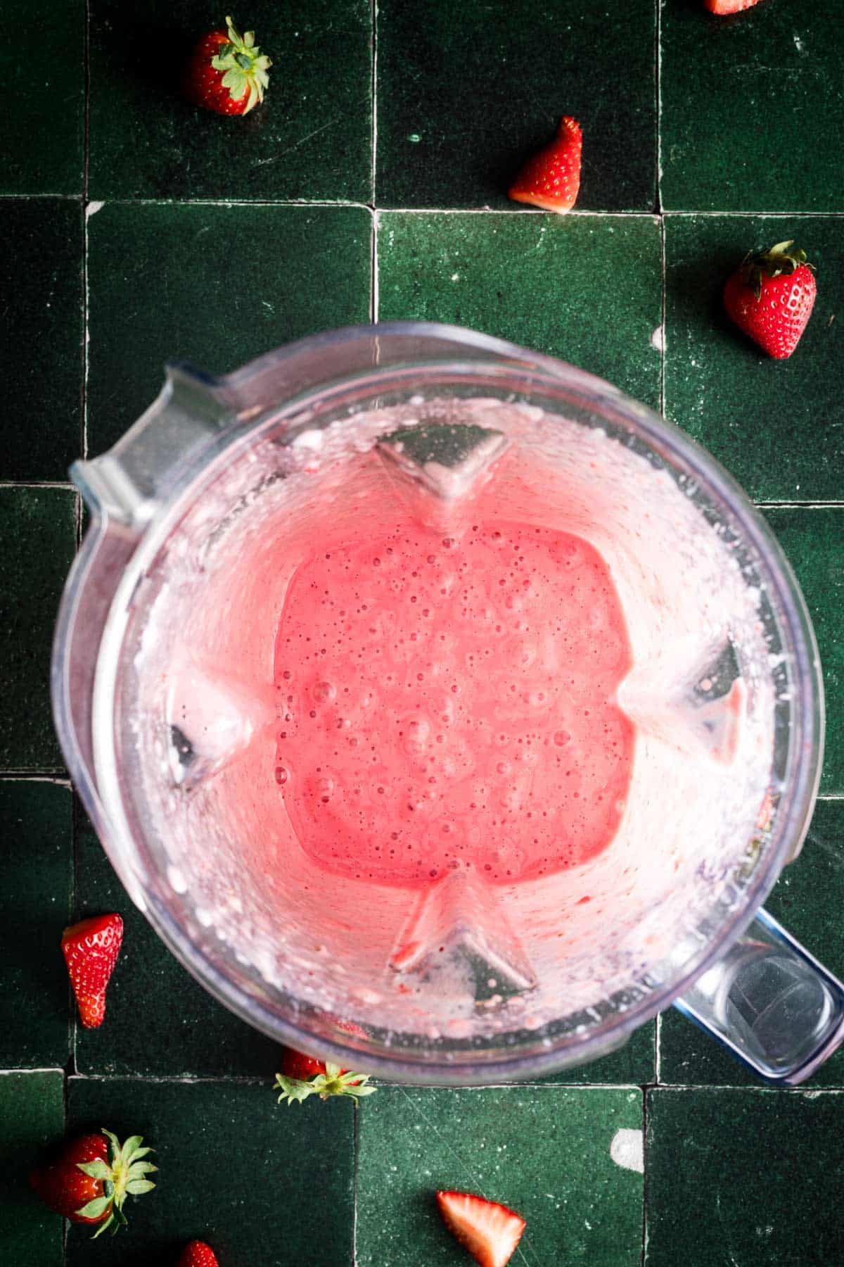 Blended no yogurt banana strawberry yogurt in a blender pitcher.