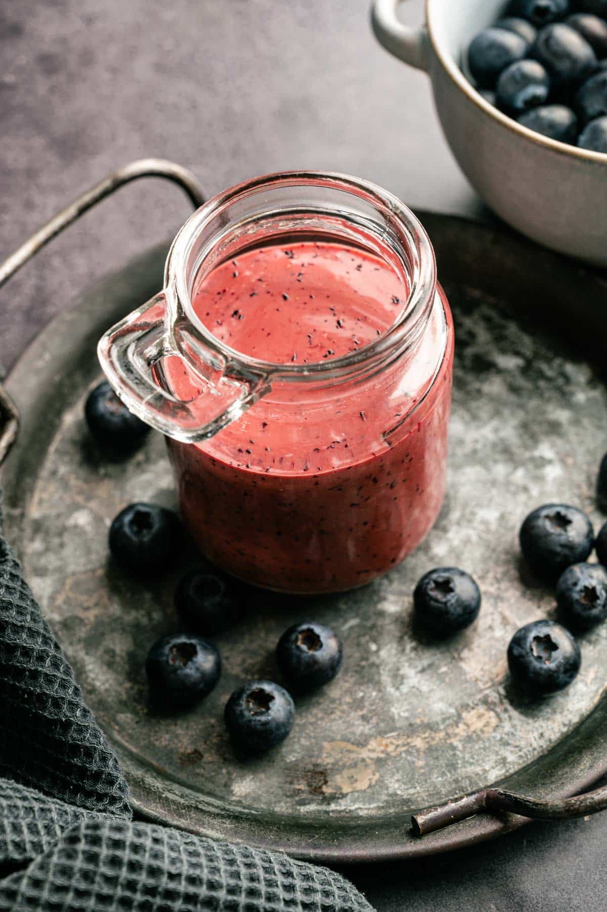 Homemade blueberry vinaigrette in a glass jar.