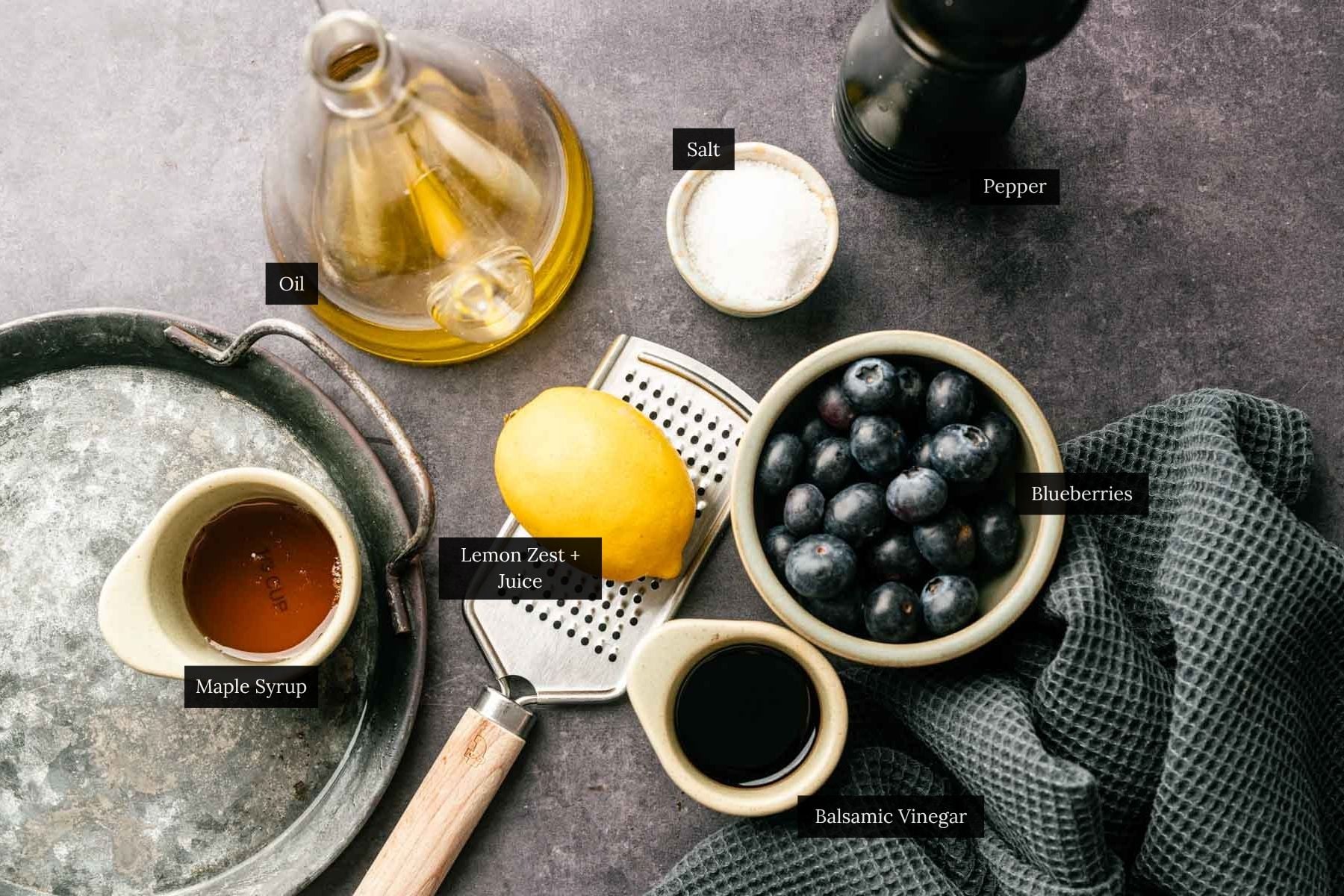 Ingredients for making a homemade vinaigrette with fresh blueberries.