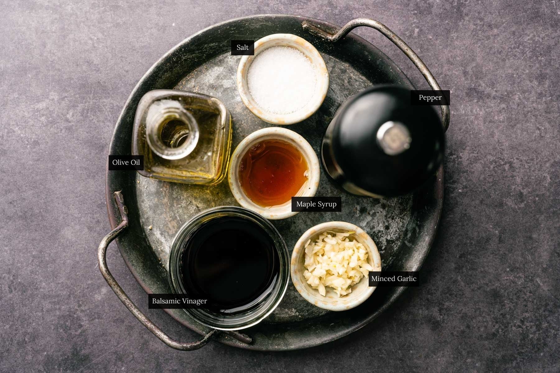 Ingredients for maple and balsamic salad dressing with each ingredient labeled.