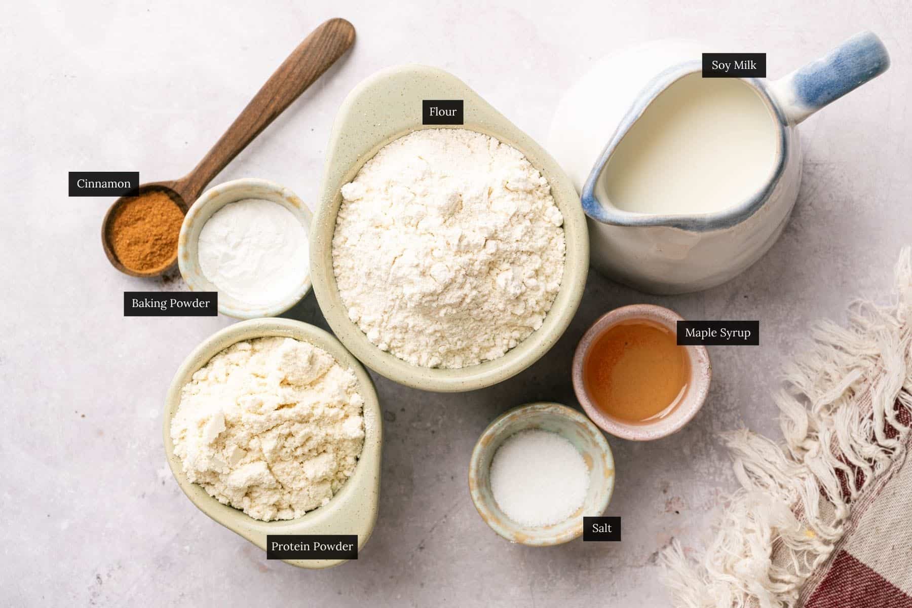 Ingredients for homemade vegan protein waffles with each ingredient labeled.