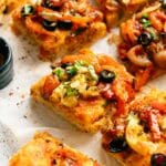 Close up of roasted vegetable pizza slices.