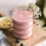 Cup of blueberry and pineapple smoothie.